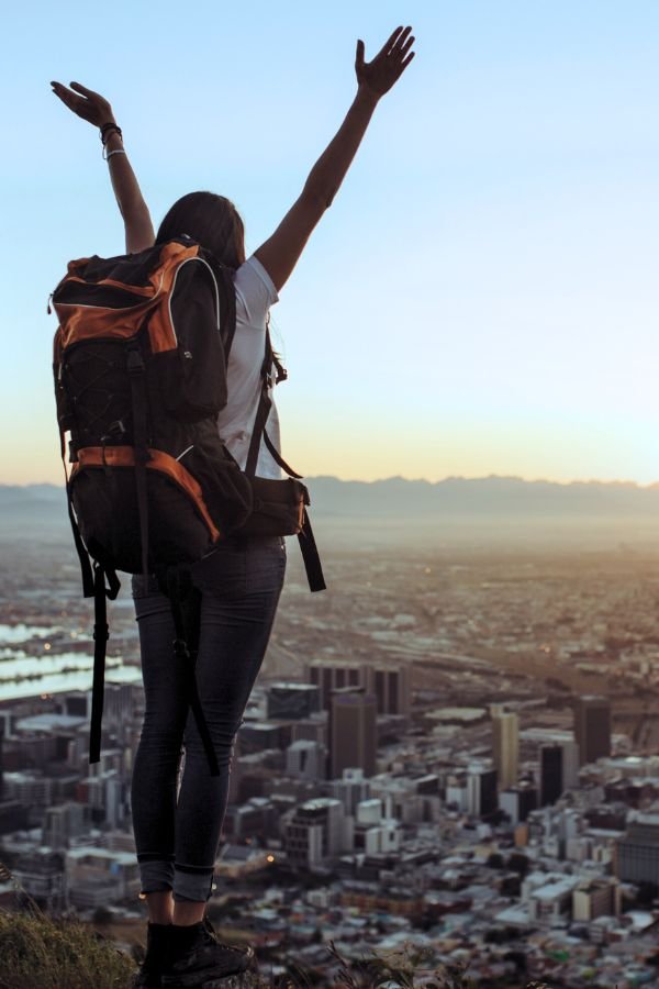 Woman solo backpacking enjoying the city views.