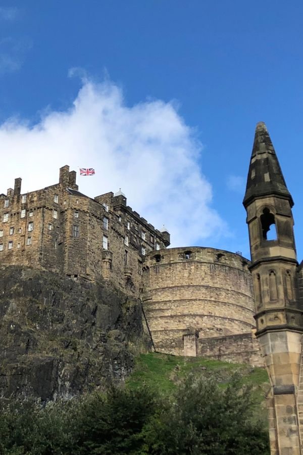 View of Edinburgh Castle on Castle Rock. Looking up from Grassmarket.