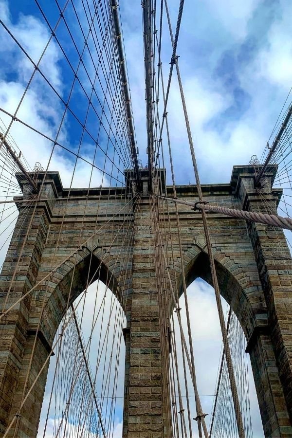 Crossing the Brooklyn Bridge. Looking up at the cables of the bridge.