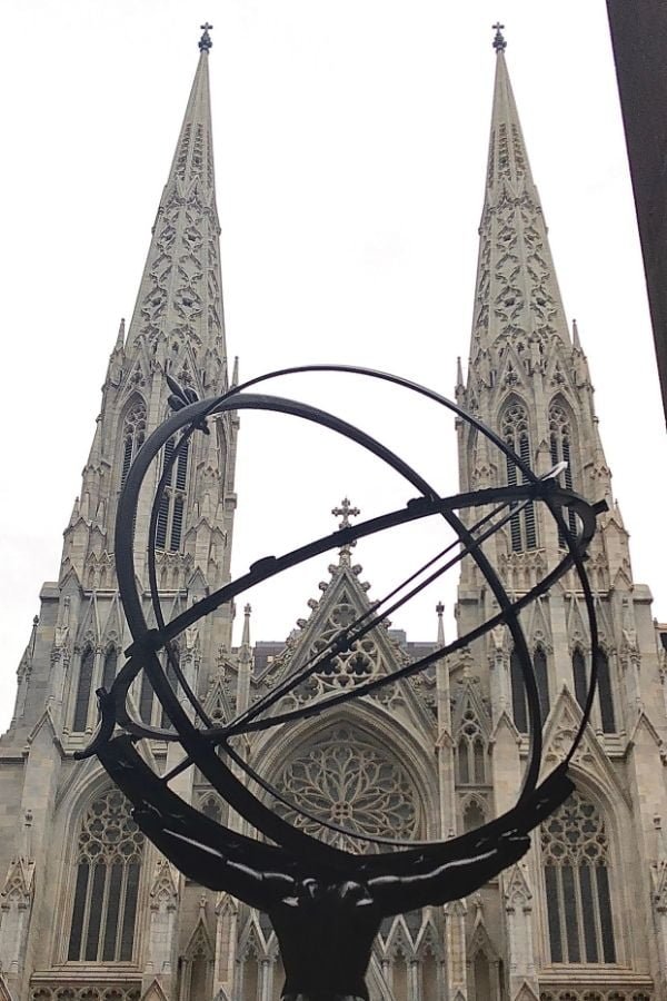 View of St. Patrick's Church in New York City. With the statue of Atlas Carrying the World in the forwground.