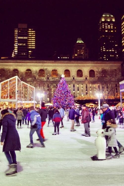 Hometown Christmas bucket list item - an outdoor ice rink where people enjoy the outdoor festivities of the holiday season.