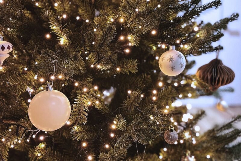 Hometown Christmas bucket list item - A Christmas tree decorated with festive ornaments. Celebrating the holiday season.