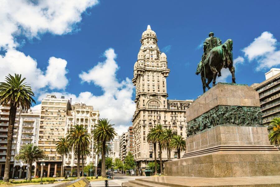 horsde statue, palace, uruguay, capital city. palm trees and builidngs. solo female travellers