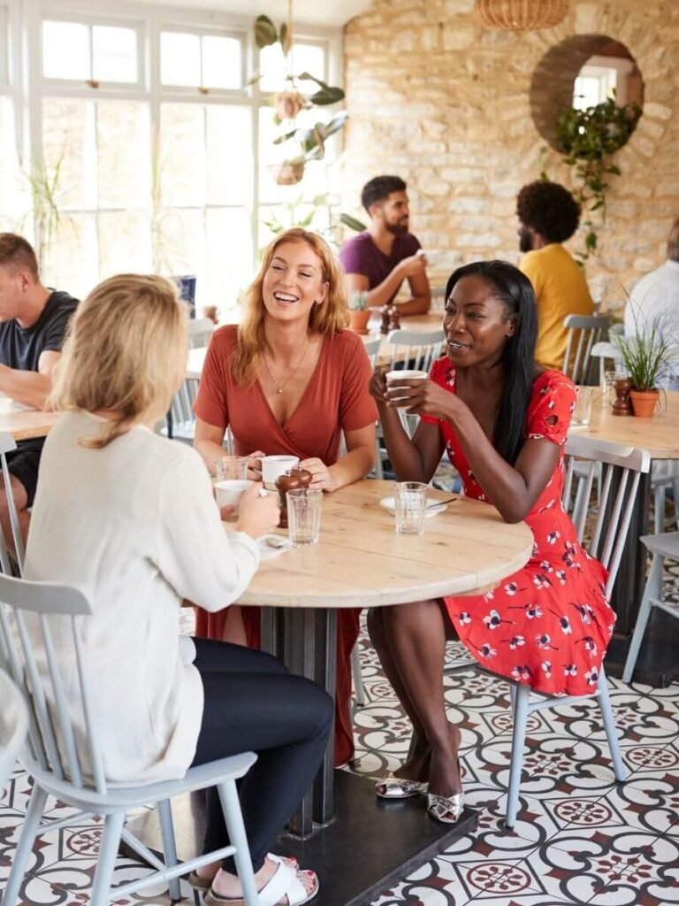 bucket list destinations for women. girls in cafe talking