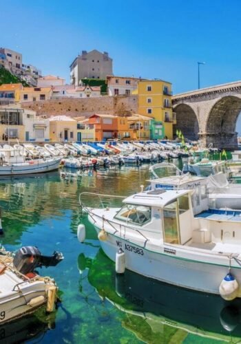 water front with boats and colourful buildings