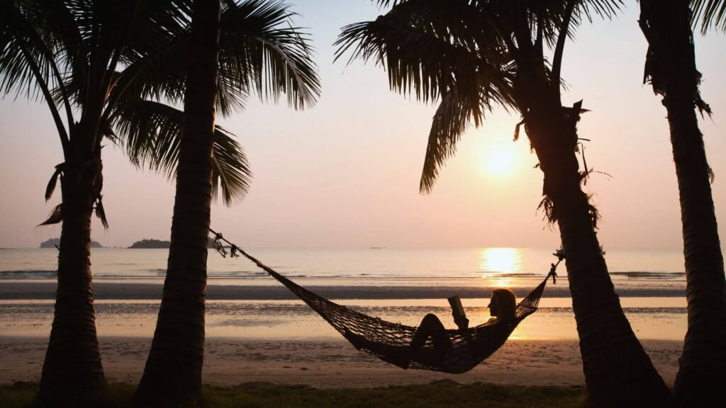 vaction books for women, woman in hammock reading on vacation
