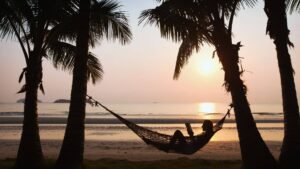 vaction books for women, woman in hammock reading on vacation